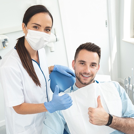 Patient in Catonsville smiling at dentist after direct bonding