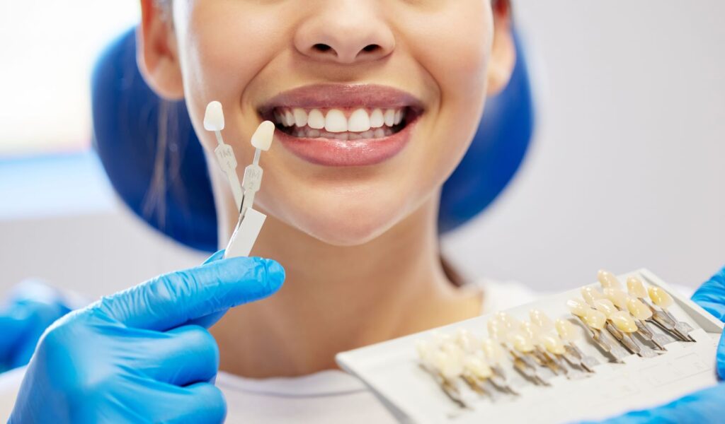 A woman at the dentist's office getting veneers.